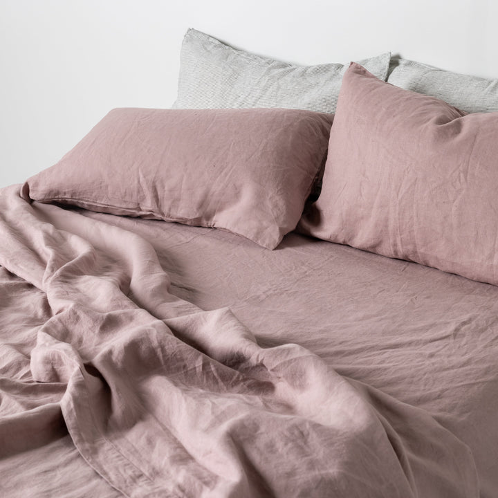 Foxtrot Home French Flax Linen styled in a bedroom with Rosewood Pink Fitted Sheet.