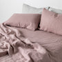 Foxtrot Home French Flax Linen styled in a bedroom with Rosewood Pink Flat Sheet.