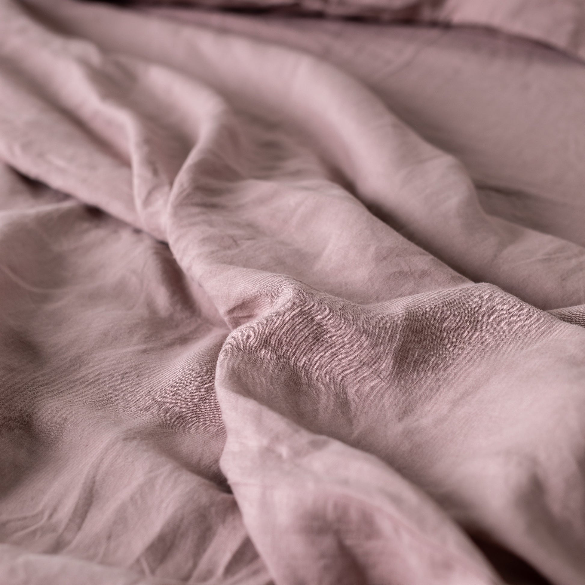 Foxtrot Home French Flax Linen styled in a bedroom with Rosewood Pink Flat Sheet.