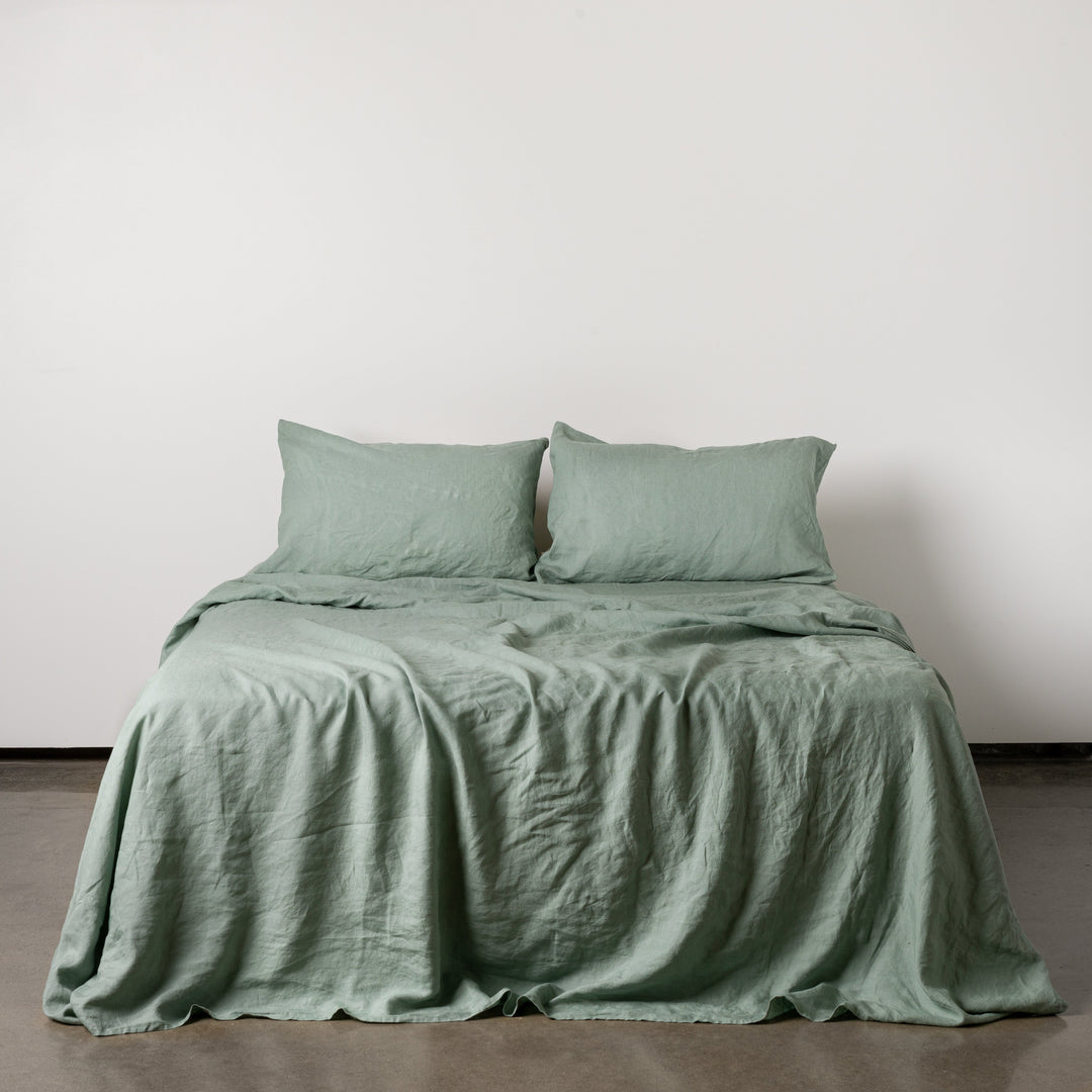 Foxtrot Home French Flax Linen styled in a bedroom with Sage Green Fitted Sheet.