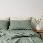 Foxtrot Home French Flax Linen styled in a bedroom with Sage Green Sheets Set.