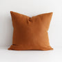 Foxtrot Home French Flax Linen styled in a bedroom with Tobacco Cushion Cover.