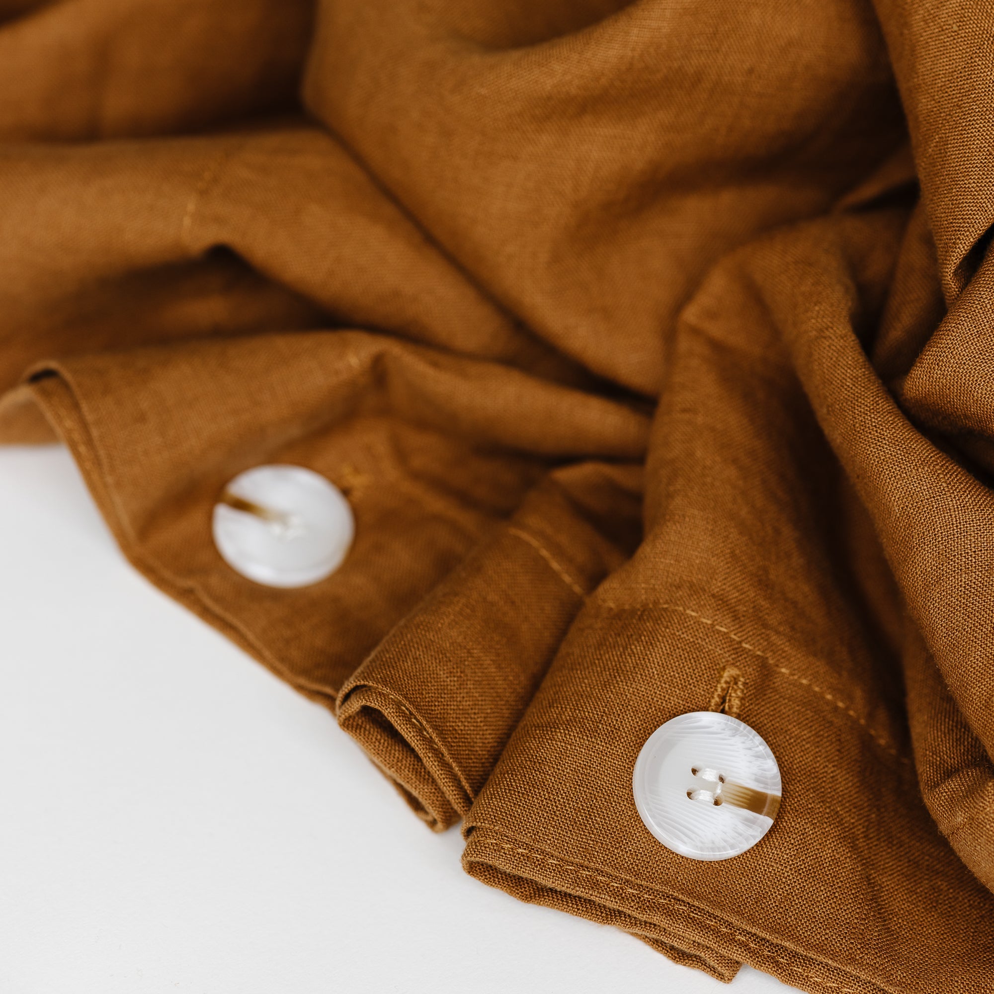 Foxtrot Home French Flax Linen styled in a bedroom with Tobacco Duvet.