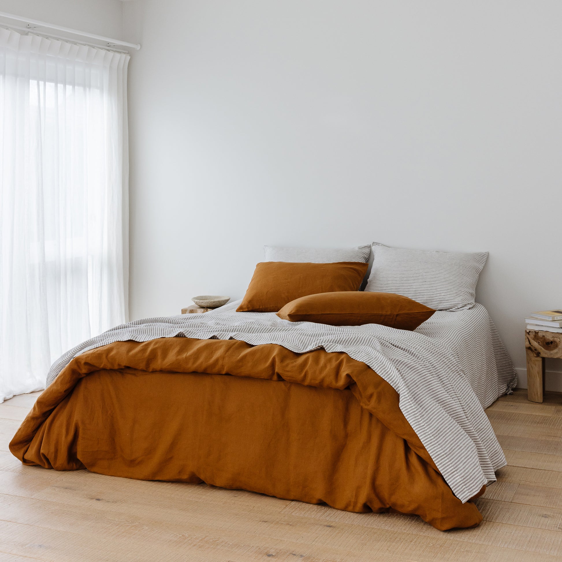 Foxtrot Home French Flax Linen styled in a bedroom with Tobacco Duvet.