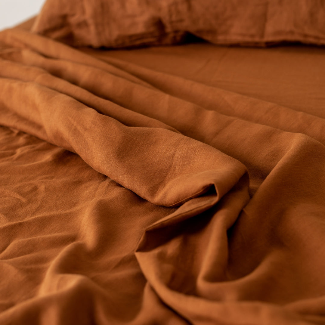 Foxtrot Home French Flax Linen styled in a bedroom with Tobacco Fitted Sheet.