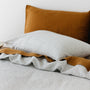 Foxtrot Home French Flax Linen styled in a bedroom with Tobacco Fitted Sheet.