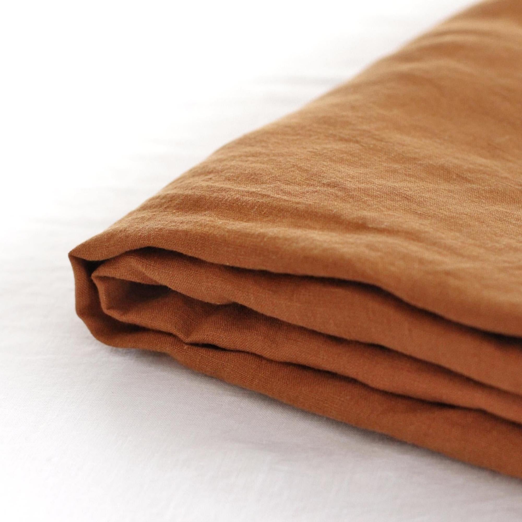Foxtrot Home French Flax Linen styled in a bedroom with Tobacco Flat Sheet.