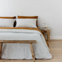 Foxtrot Home French Flax Linen styled in a bedroom with Tobacco Flat Sheet.