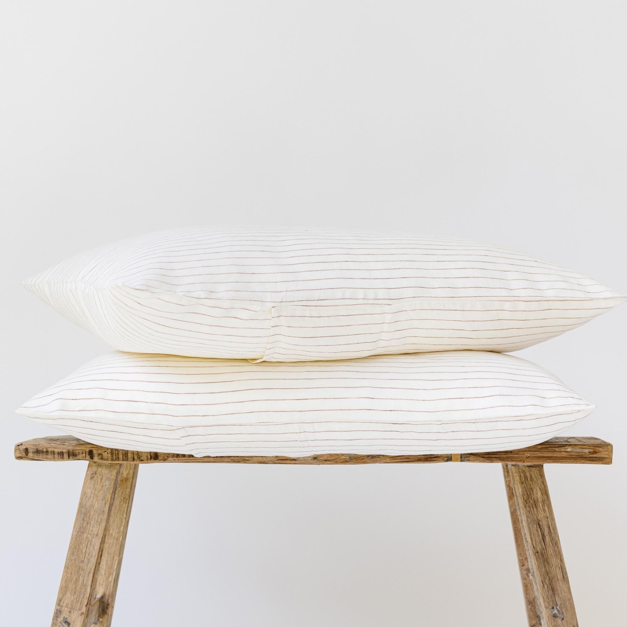 Foxtrot Home French Flax Linen styled in a bedroom with Tobacco Stripes Pillowcases.