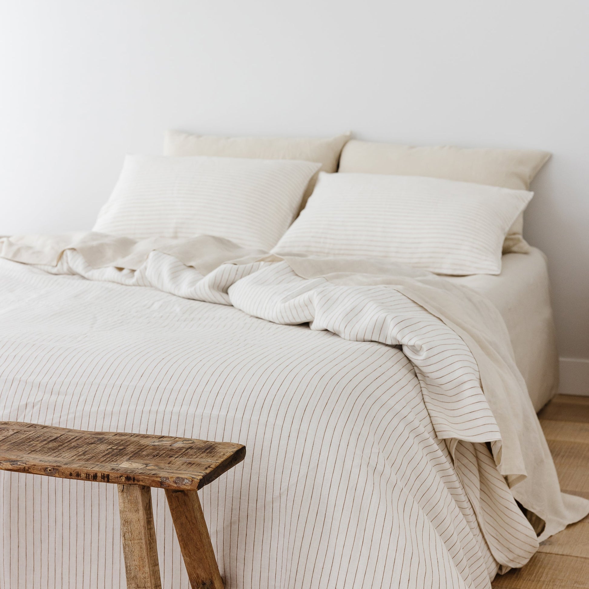 Foxtrot Home French Flax Linen styled in a bedroom with Tobacco Stripes Pillowcases.