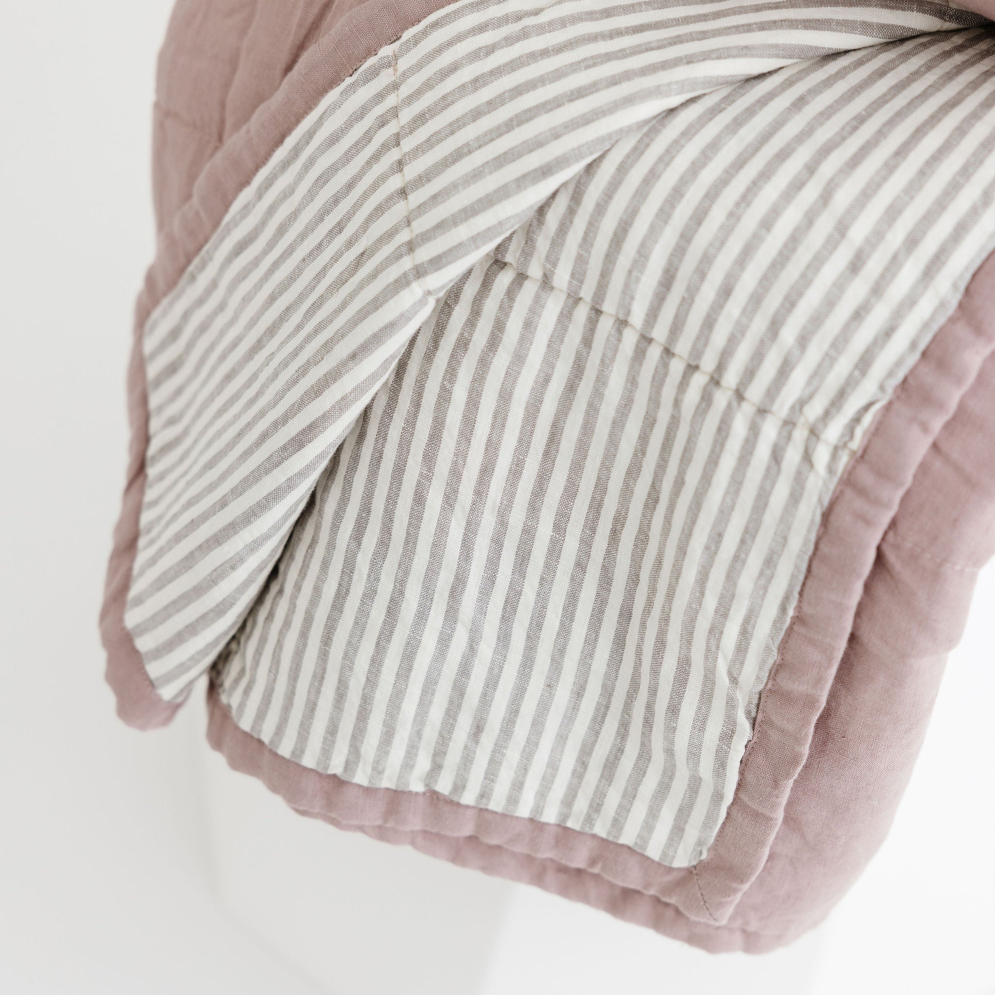 Foxtrot Home French Flax Linen Quilt in Rosewood with Grey Stripes on the reverse