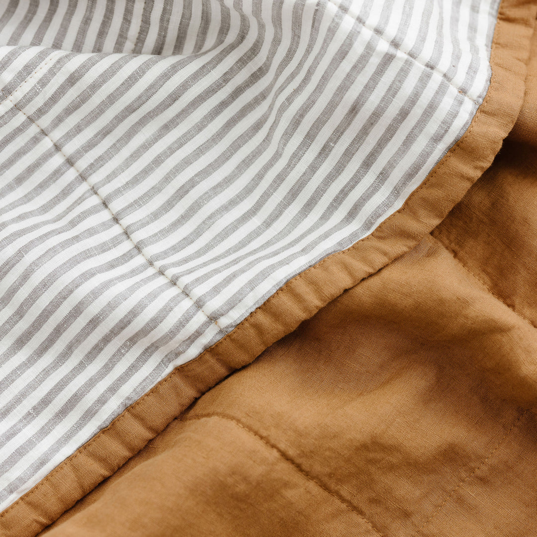 Foxtrot Home French Flax Linen Quilt in Ochre with Grey Stripes on reverse