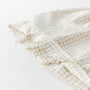 Foxtrot Home French Flax Linen styled in a baby's bedroom with a Malt Brown Grid Cot Duvet.