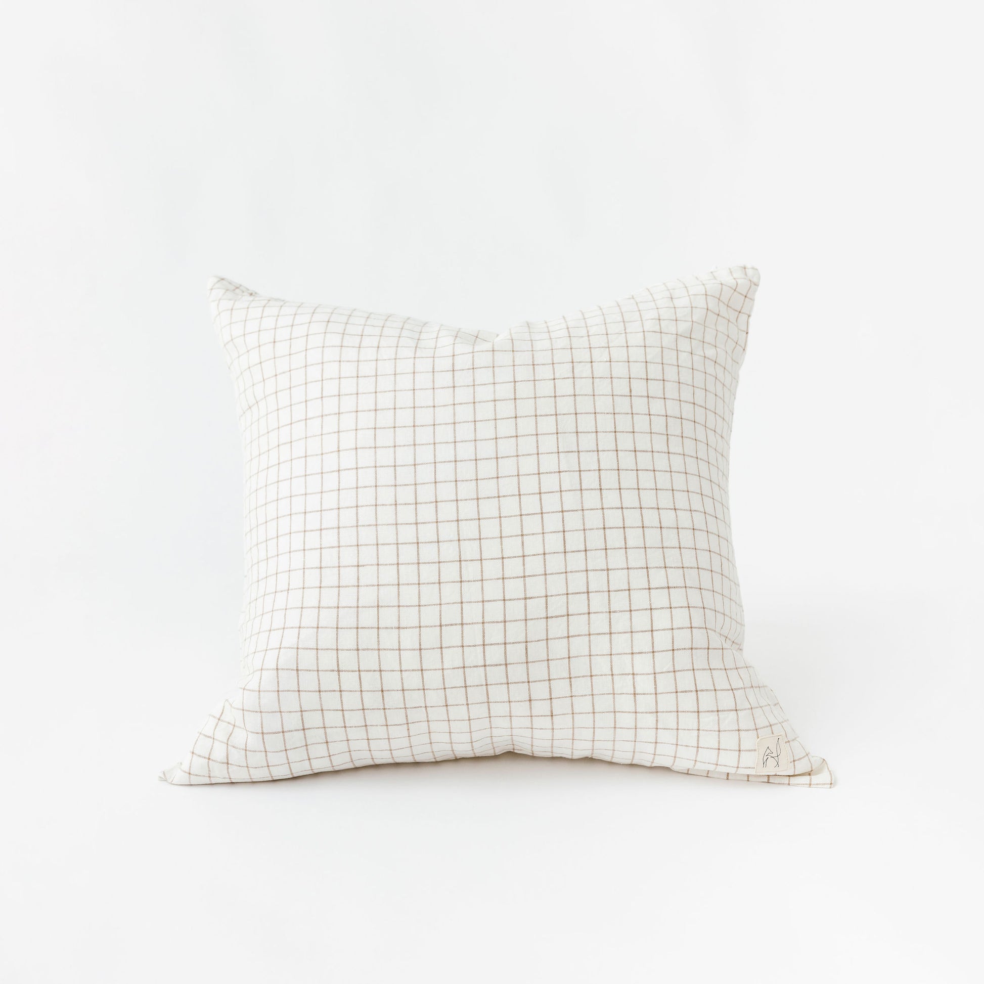 Foxtrot Home French Flax Linen styled in a bedroom with Malt Brown Grid Cushion Cover.