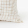 Foxtrot Home French Flax Linen styled in a bedroom with Malt Brown Grid Cushion Cover.