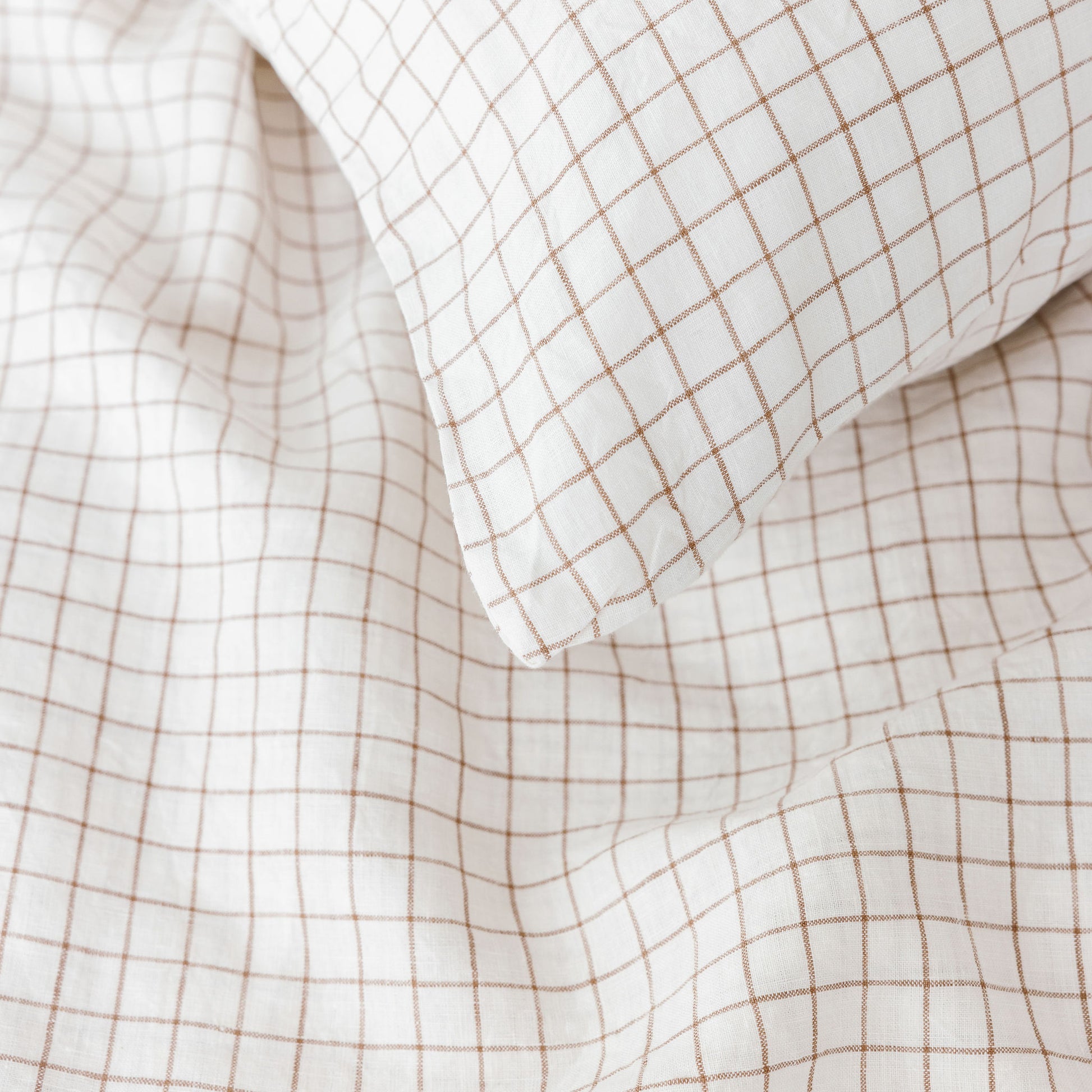 Foxtrot Home French Flax Linen styled with a Malt Brown Grid Duvet