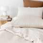 Foxtrot Home French Flax Linen styled with Malt Brown Grid PIllowcases and Oat Sheets