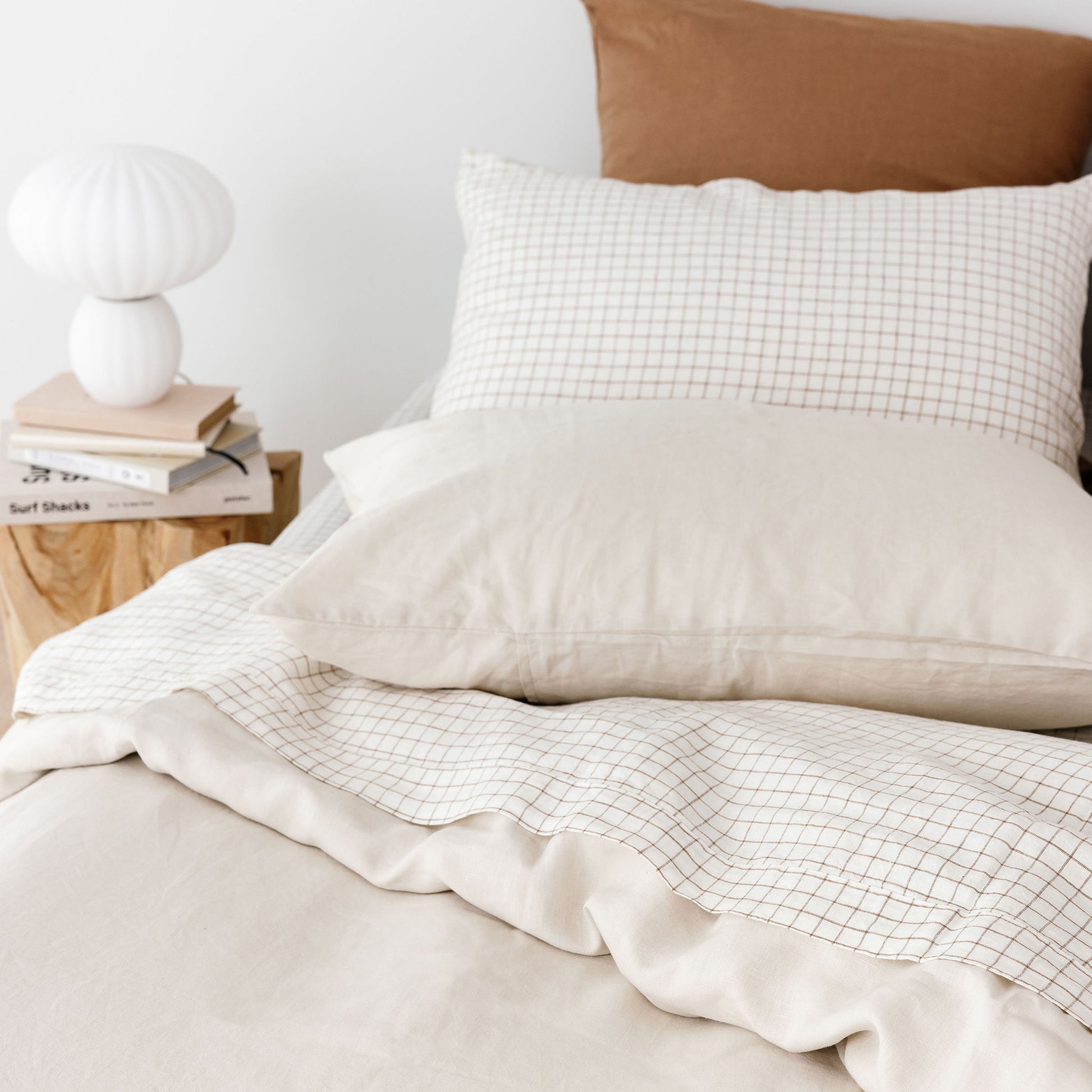 Foxtrot Home French Flax Linen styled with Malt Brown Grid PIllowcases and Oat Sheets