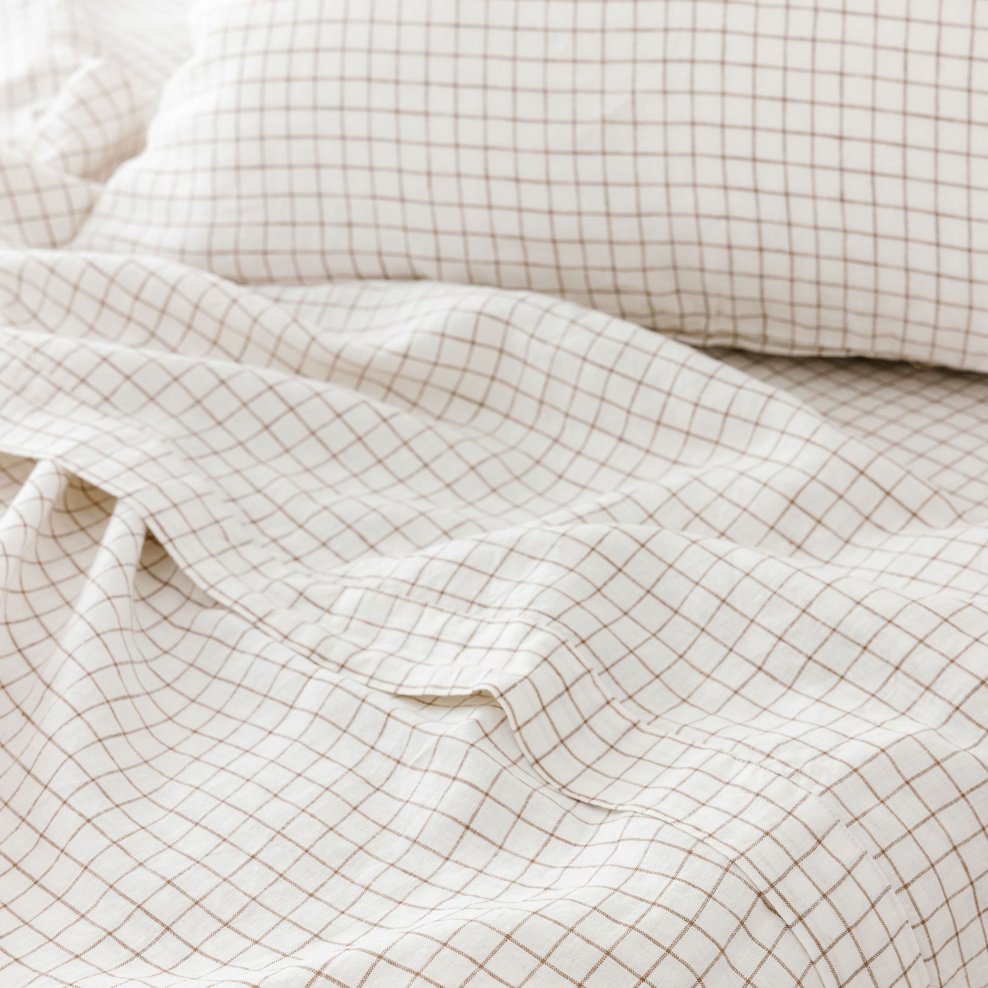 Foxtrot Home French Flax Linen styled with Malt Brown Grid PIllowcases